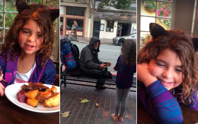 Niña comparte su comida con un hombre de la calle