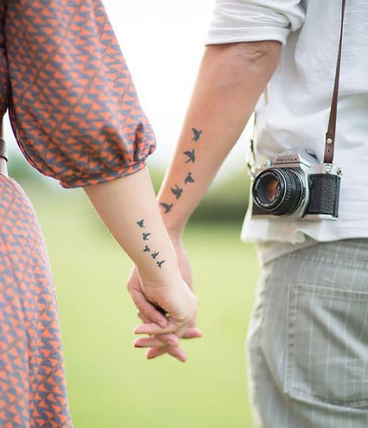 Tattooed hipster couple